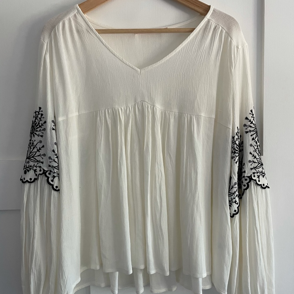 Francesca’s embroidered black flowers top